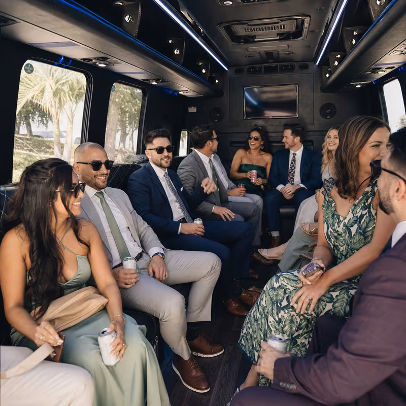Wedding guests seated inside a Boca Raton party bus