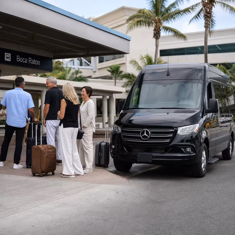Group boarding a white charter bus for Airport Transportation transportation in Boca Raton