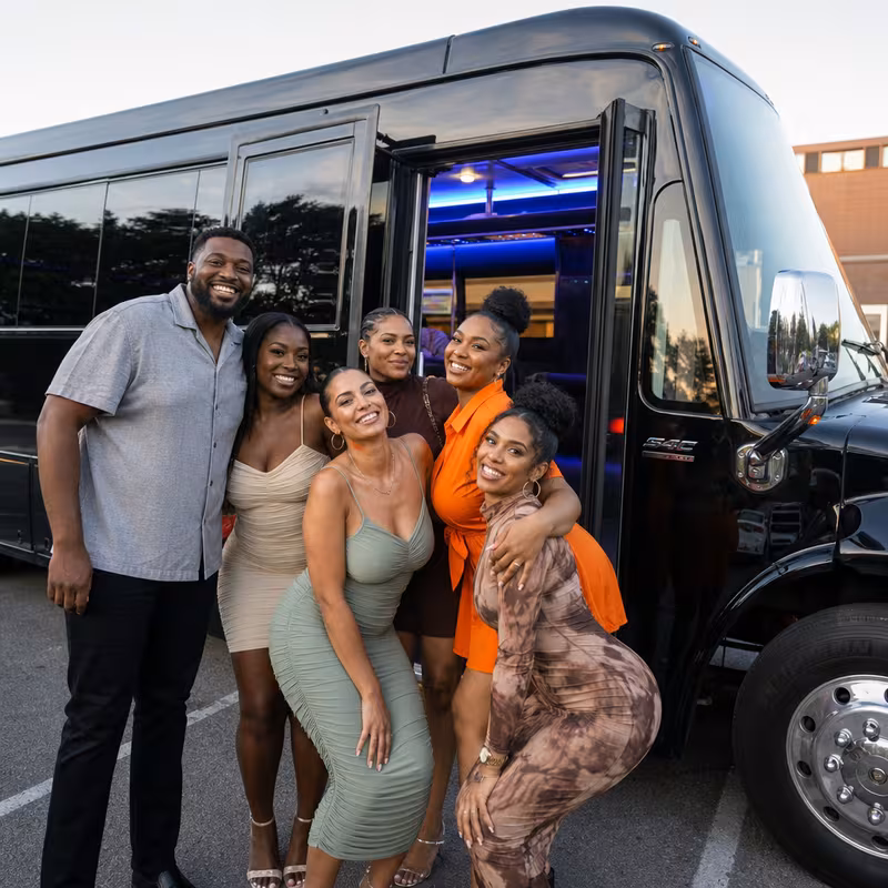 Party bus interior with wraparound leather seating and LED lighting in Boca Raton