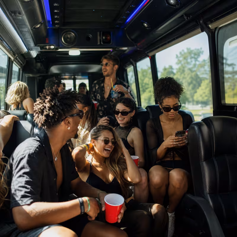 Passengers loading luggage while boarding an Boca Raton group shuttle