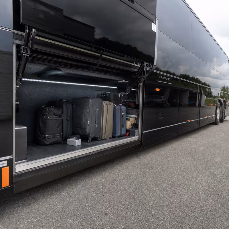 Party bus interior with wraparound leather seating and LED lighting in Boca Raton