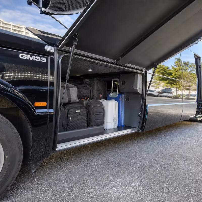 Party bus interior with wraparound leather seating and LED lighting in Boca Raton