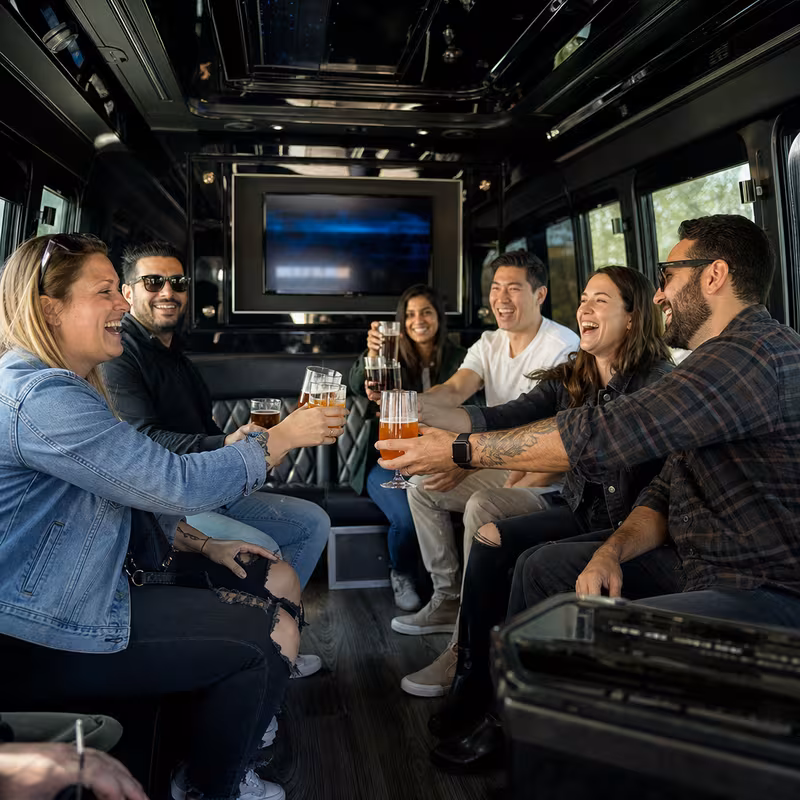 Group boarding a white charter bus for Winery & Brewery Tour Transportation transportation in Boca Raton